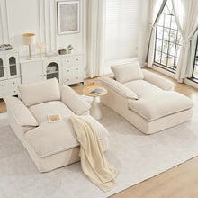 Load image into Gallery viewer, Beige sectional sofa in a bright living room with white walls and large windows.