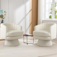 Load image into Gallery viewer, Two white armchairs in a modern living room with a small table between them.
